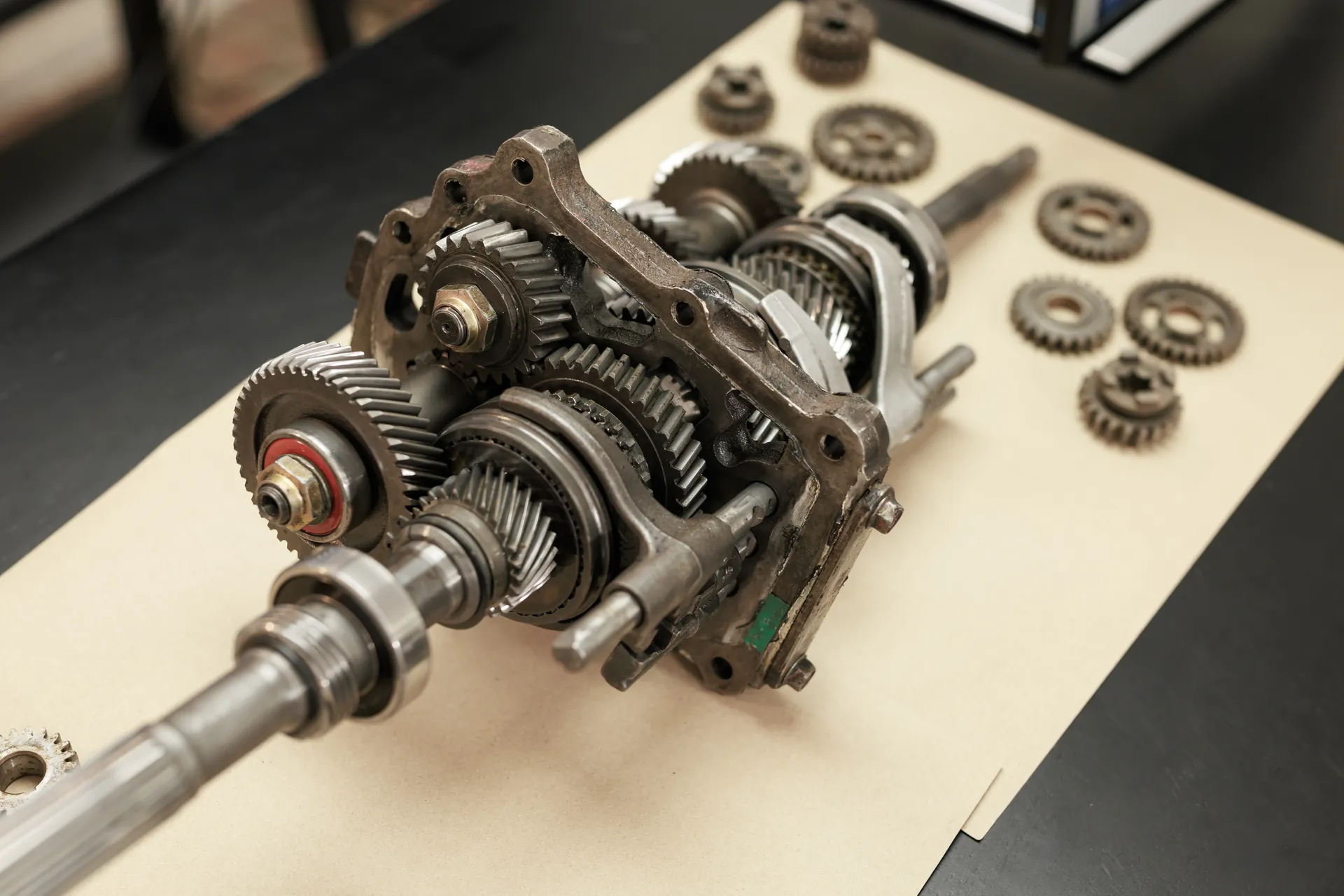 Disassembled manual transmission on a workbench during gearbox repair in Vaughan