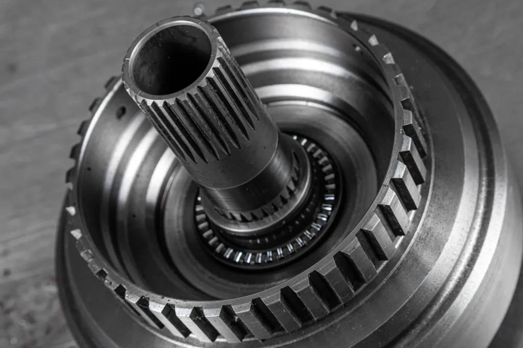 Close-up of a dual-clutch gearbox hub and splined shaft