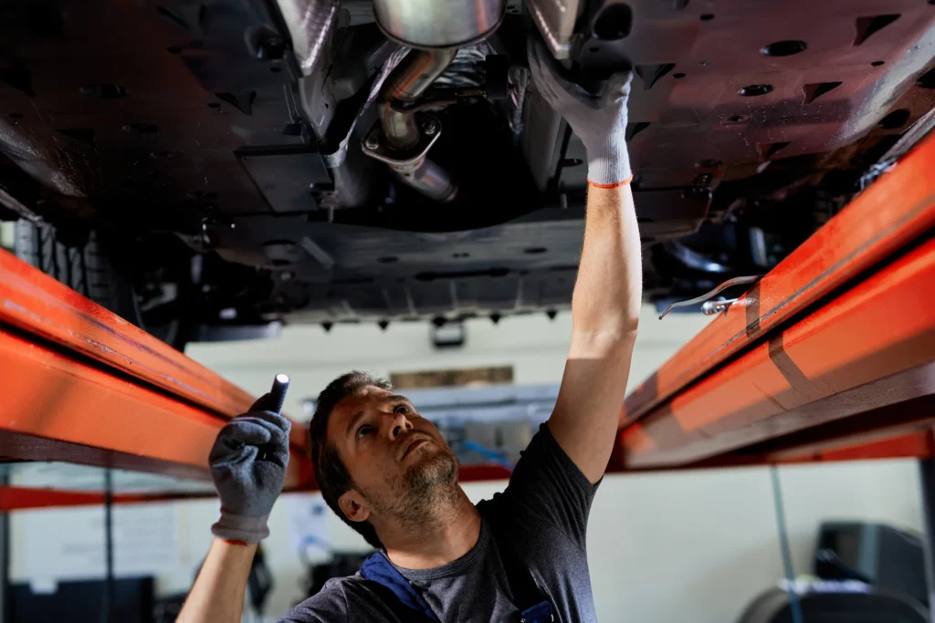 Technician inspecting the underside of a vehicle during transmission diagnostics in Woodbridge